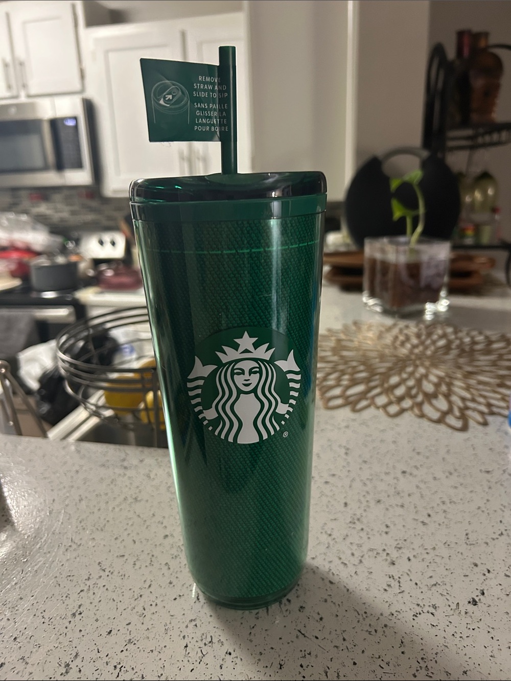 Starbucks 24 oz cup with straw.